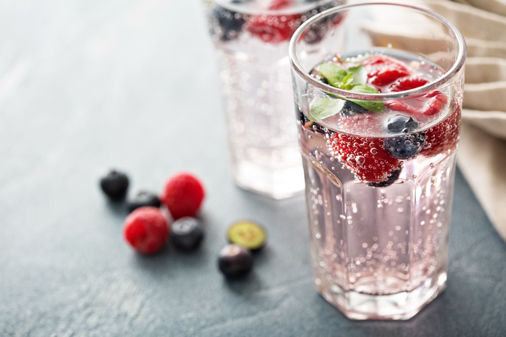 Sparkling water with mixed berries added in